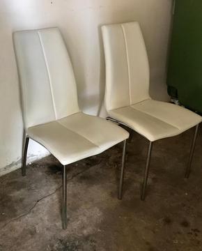 2 cream faux leather chairs - a shame to go the tip!