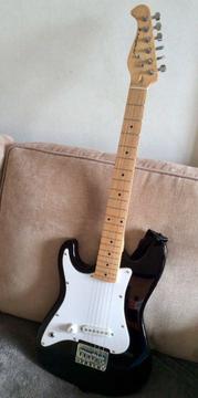 Left handed black and white Westfield electric guitar