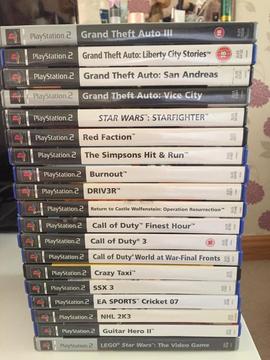 PS2 console with controller, steering wheel and 19 games