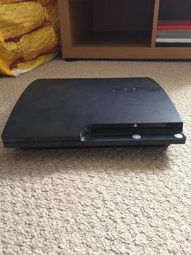 PS3 console with 18 games and a controller