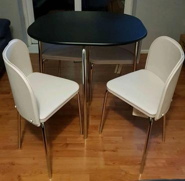 Brand new black table with 4 cream chairs