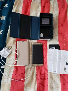 Samsung s7 edge 32 gb gold like new with 64gb sd card & official Samsung case