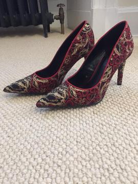 Never worn red, gold and black heels