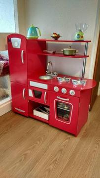 Wooden red toy kitchen and accessories