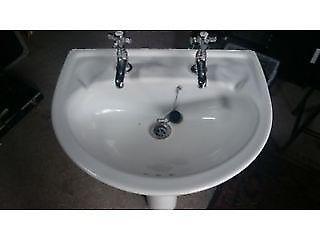 Pedestal sink with taps