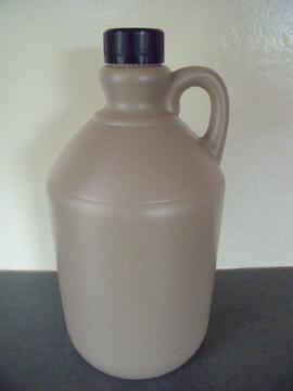 Empty 2.4 l stone-coloured plastic beer,cider flagon,bottle - integral handle,black screw lid. £1.50