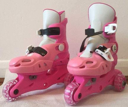 Girl's adjustable tri-skates. Pink. Sizes 9-12