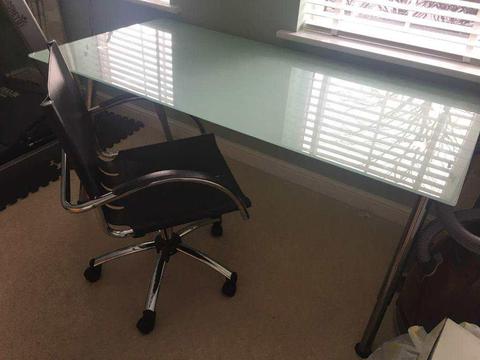 Glass office desk and black / steel desk chair
