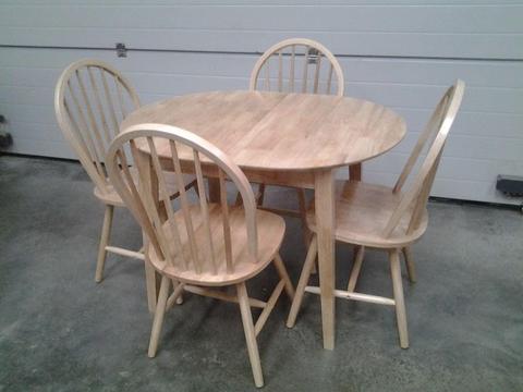 Ex display Bargain. Small extendable wooden table and 4 chairs. Very good. Can deliver
