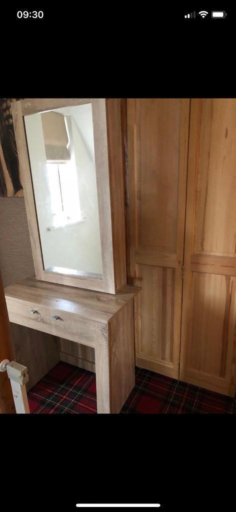 Dressing table with sliding mirror