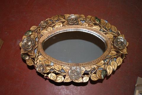 Beautifully carved oval mirror with coloured glass rose design