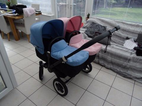Bugaboo Donkey Duo with Blue and Pink Hoods and Black Chassis - Excellent condition