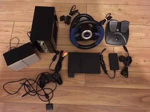 Sony PS2 slim console and 42 games, steering wheel and sound system