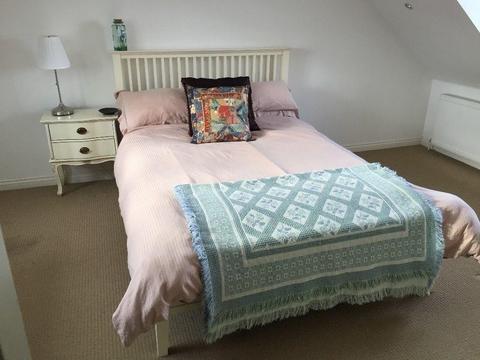 Wood frame double bed with mattress