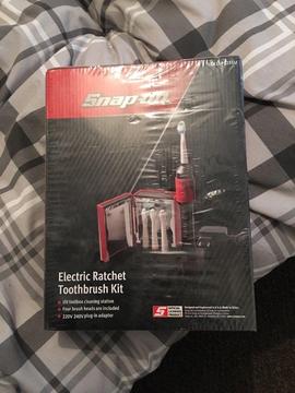 Snap on collectible electric toothbrush