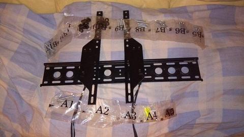 Slim Tilt TV Wall Bracket / Mount [ with packets of Level bolts and wall mounting plugs and screws ]