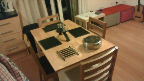 As new, dining table and 4 chairs