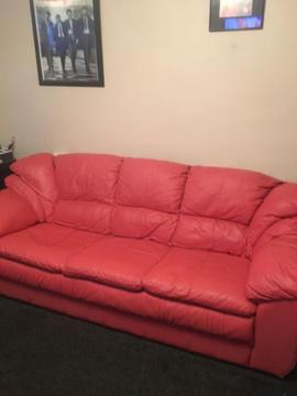 Pink 3 seater leather sofa taker collects will need two people, no rips fire lable