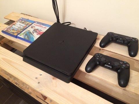 PS4 Slim 1TB (8 months old) with 3 year care plan + 2 controllers, GTA 5 & Wipeout