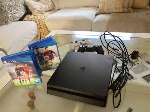 PS4 Slim 500gb with 2 controllers, FIFA 15, FIFA 16 and cables