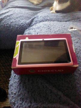 android tablet in pink with charger