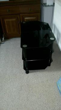 Black tempered glass 3 shelf TV stand. Excellent condition