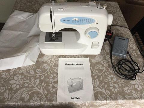 Brother Sewing Machine in working order, with manual, foot pedal and cover