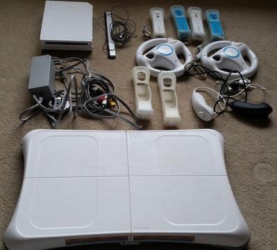 Nintendo Wii Pack including games, 4 controllers, 2 nunchucks, 2 steering wheels and balance board