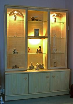 Lovely wood grain effect wall unit/display cabinet with interior lights and cupboards with shelves