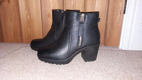 Brand new size 5 black ankle boots with chunky heel and tassle zip detail