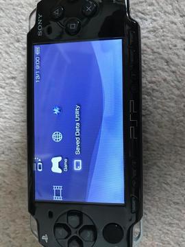 PSP 2000 with charger, case & 3 games