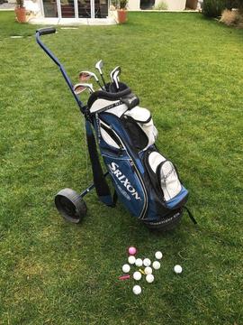 Golf clubs and trolley
