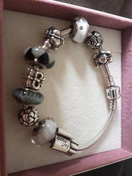 Genuine pandora silver bracelet with charms