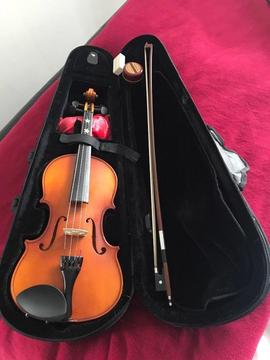 Violin, bow, rosin and carrying case. Excellent condition. I think this is 3/4 size violin