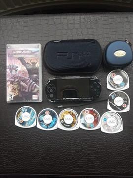 Sony PSP with charger/case 8 assorted games/films