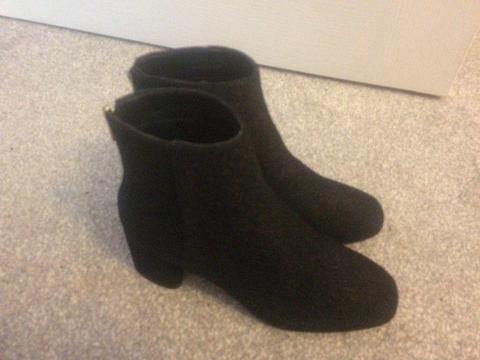 Black size 4 ankle boot. Brand new, never worn , slim fit