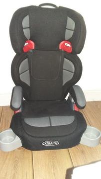 Children's booster car seat with adjustable and removable back