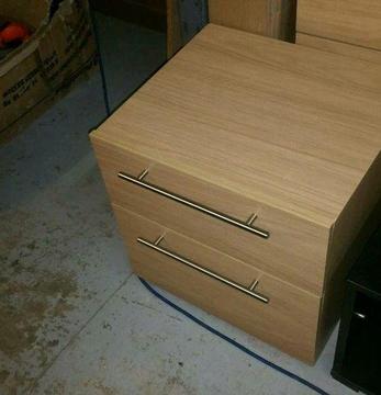 A brand new oak effect 2 drawer bedside table