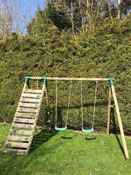 Children’s wooden swing and climbing frame