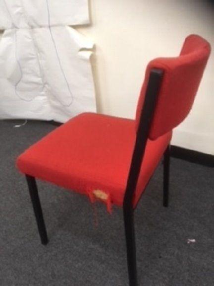 FREE. Approx 100 red office chairs. Damaged fabric but worth recovering