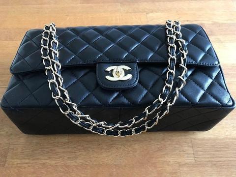 This Season's Ladies Black Leather Chanel Handbag with gold plated and leather chain