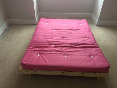 Pink futon. Good condition, never slept on