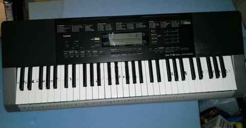 Casio CTK4400 electric keyboard with stand