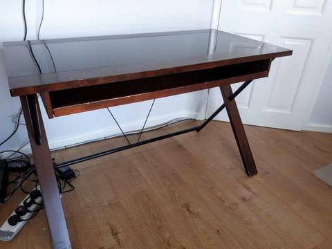 Computer table. Dark wood with dark glass inlay and pull out keyboard/ storage shelf